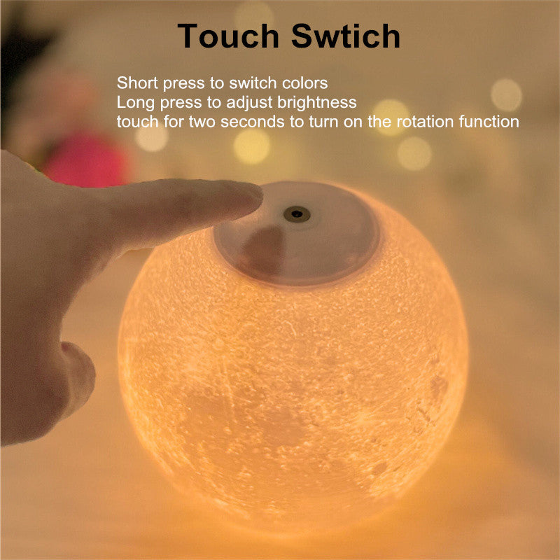 Close-up of touch switch on magnetic levitating moon lamp showing color and brightness controls.